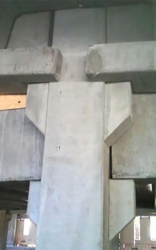 Stevens Creek Parking Garage: Lower LB tieback at interior, ledge projects from end of beam to resist torsional moment.